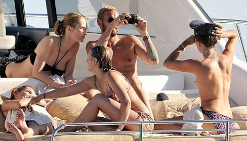 rich-topless-sunbathe